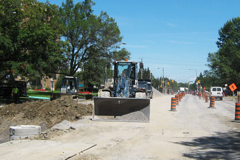 Construction equipment resurfacing road