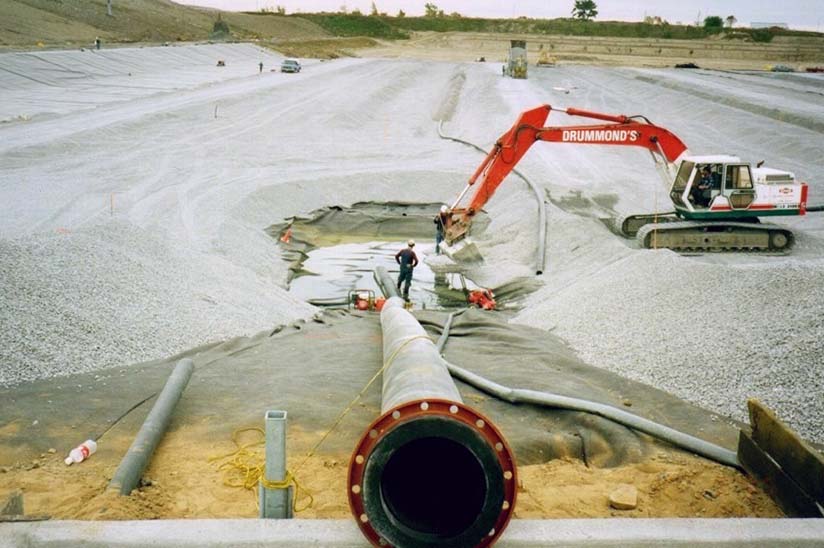 Construction at Trail Road Waste Facility with backhoe