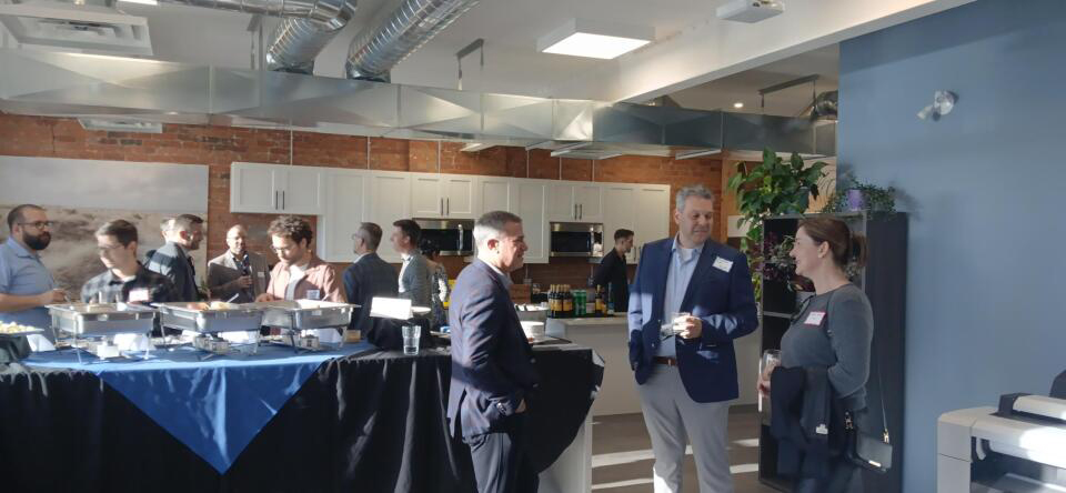 JLR North Bay's 20th anniversary party guests mingling.