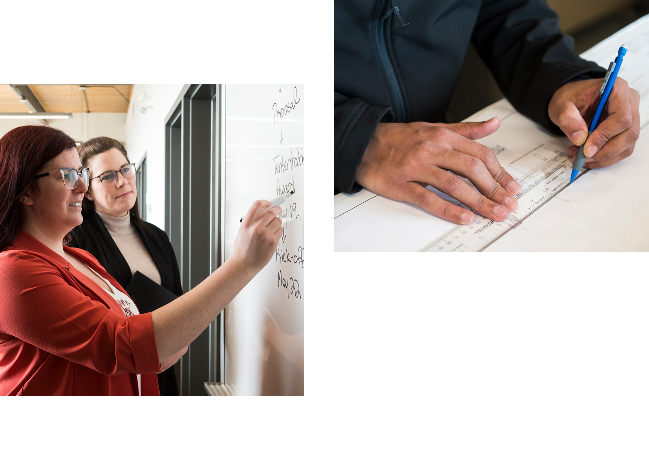 Two women at a white board, a man's hands drawing with ruler