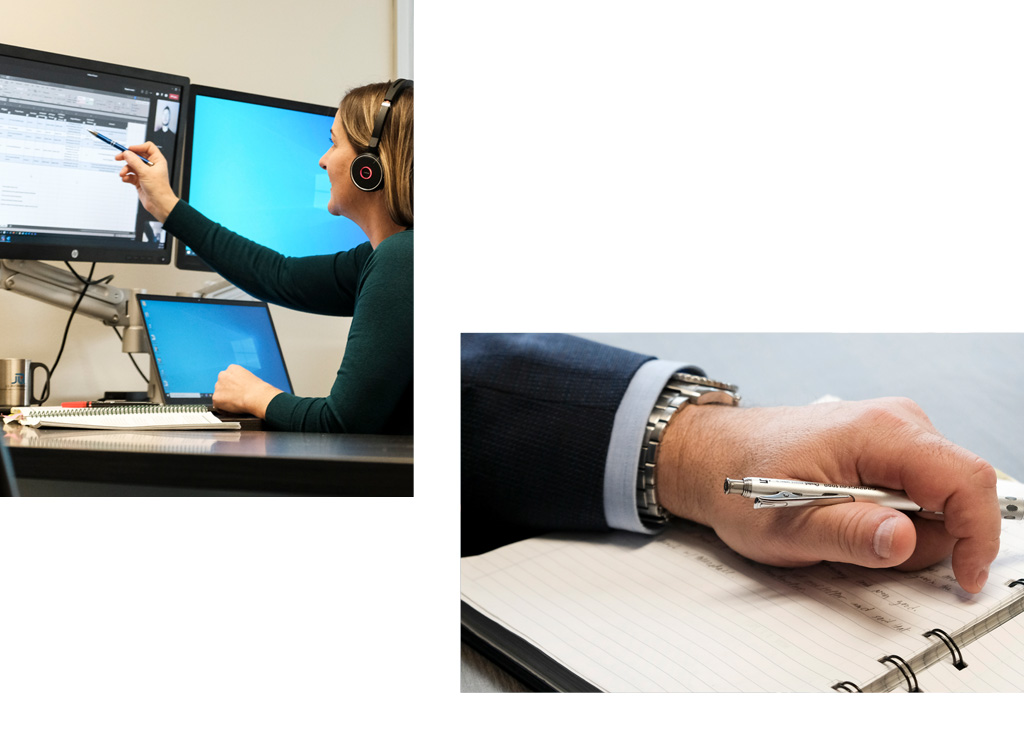 Woman working at computer, man's hand on notebook